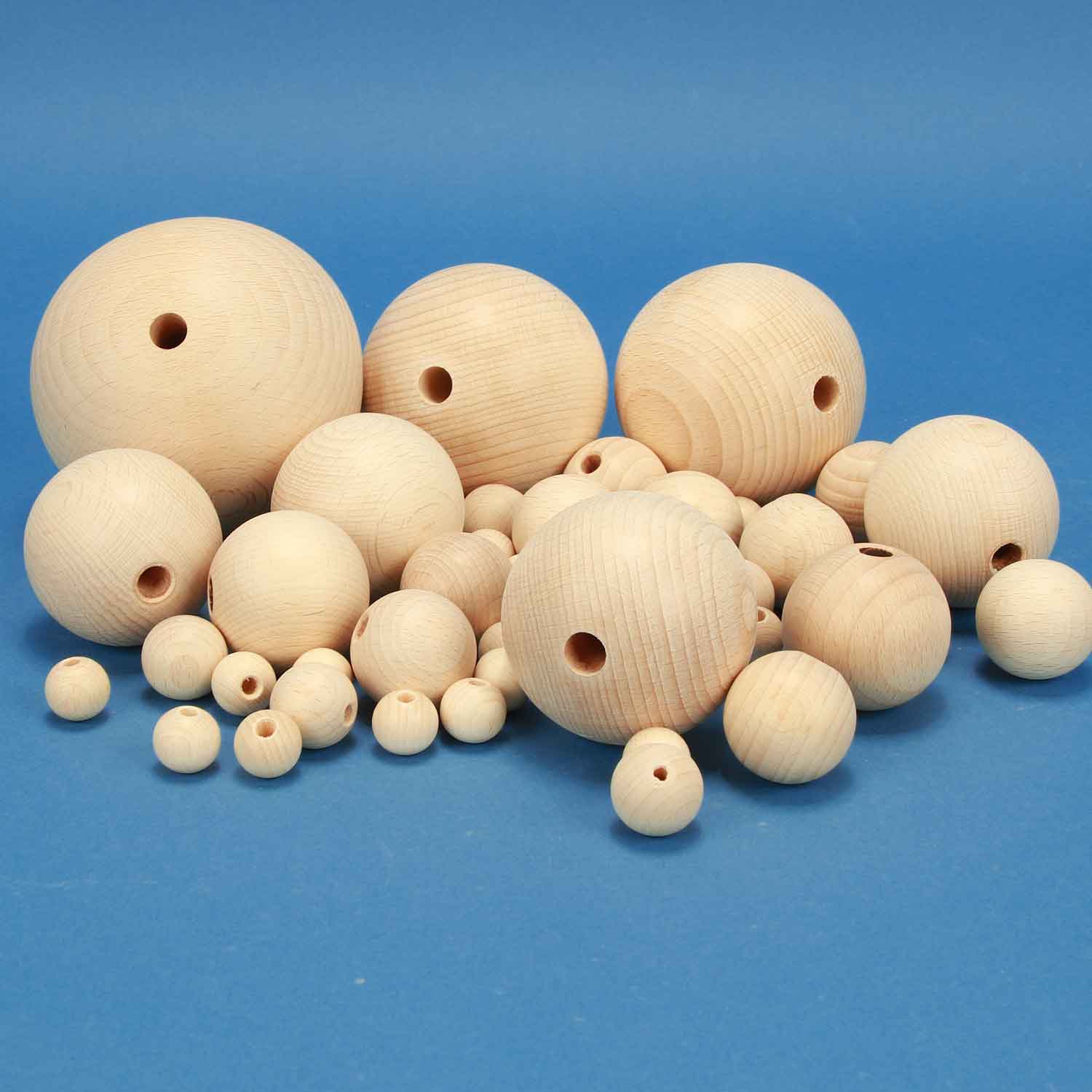 wooden balls half drilled